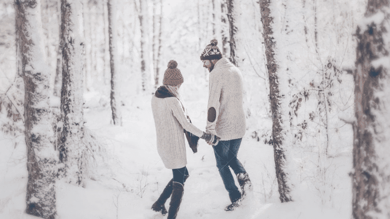 couple walking through the snow holding hands - dear husband