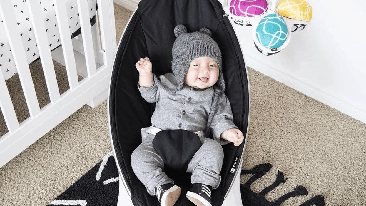 baby in a baby swing