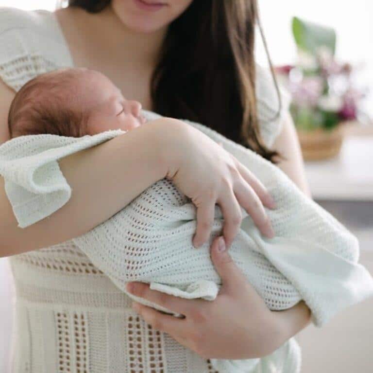 woman carrying a baby