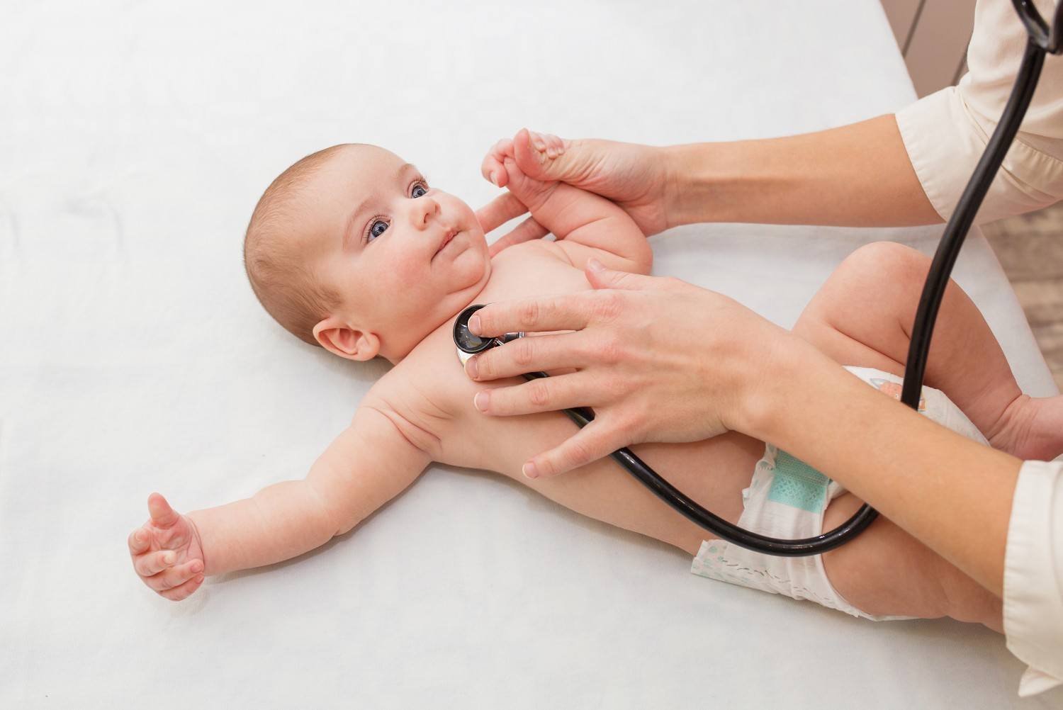 doctor checking baby's heartbeat