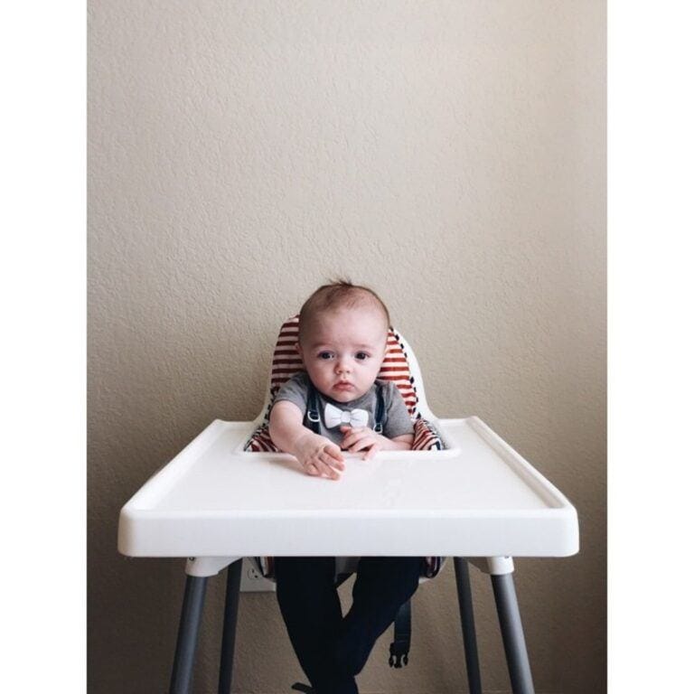 baby sitting in a high chair