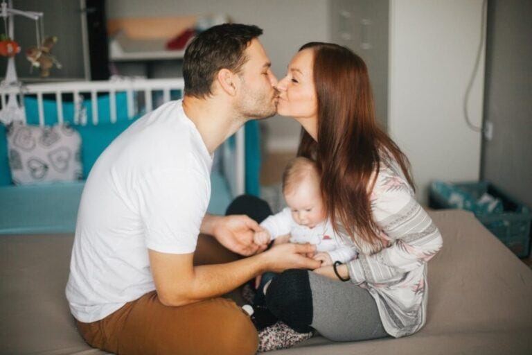 man and woman kissing