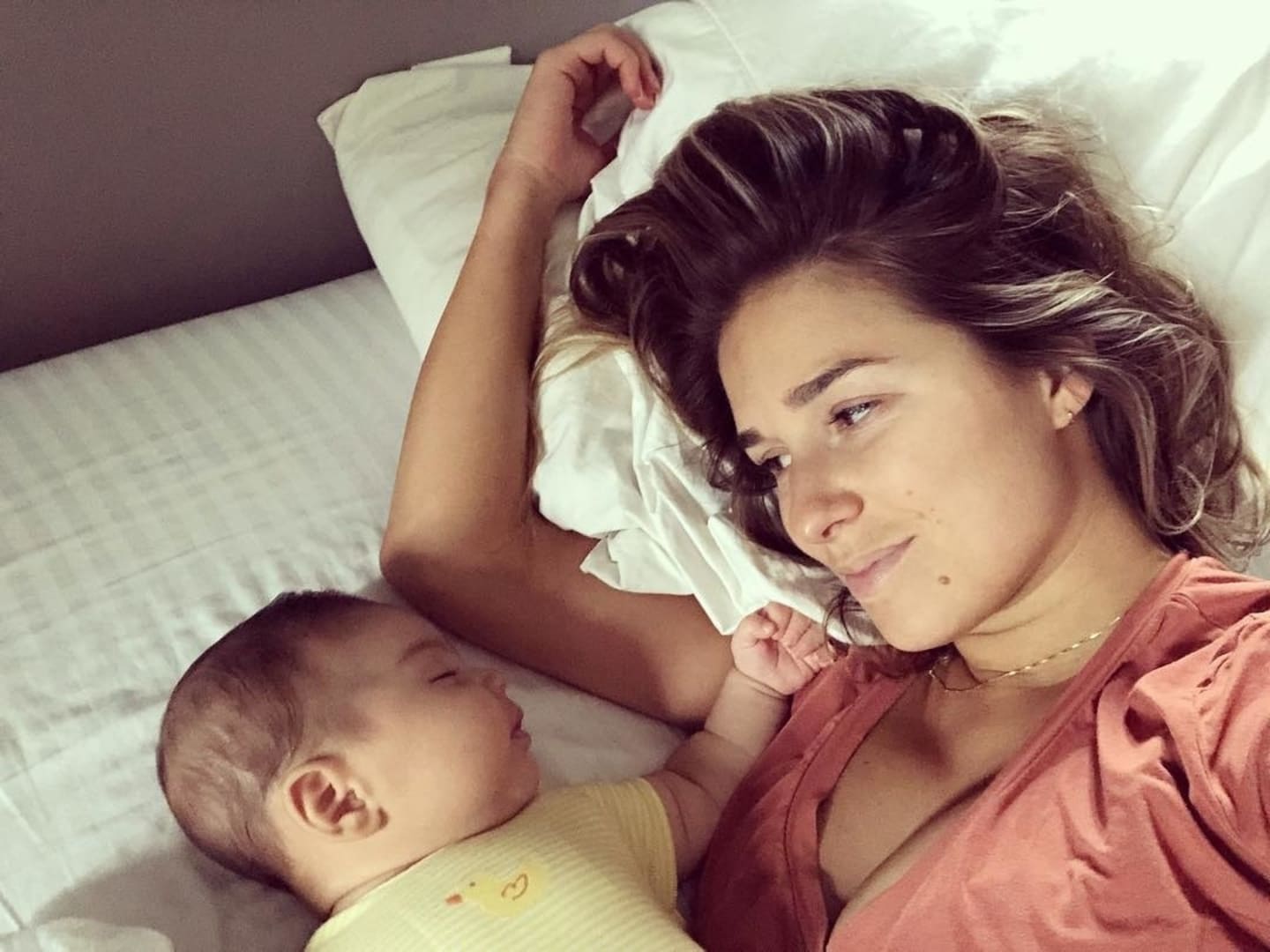 Jessie James Decker looking at her baby