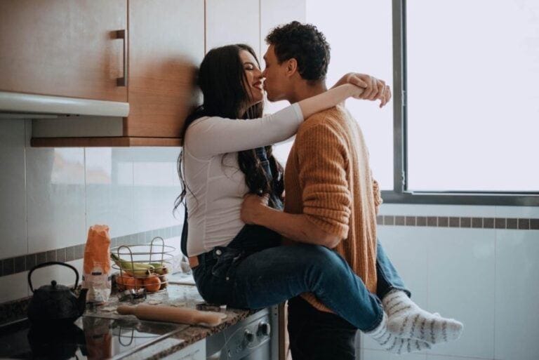 man and woman in the kitchen