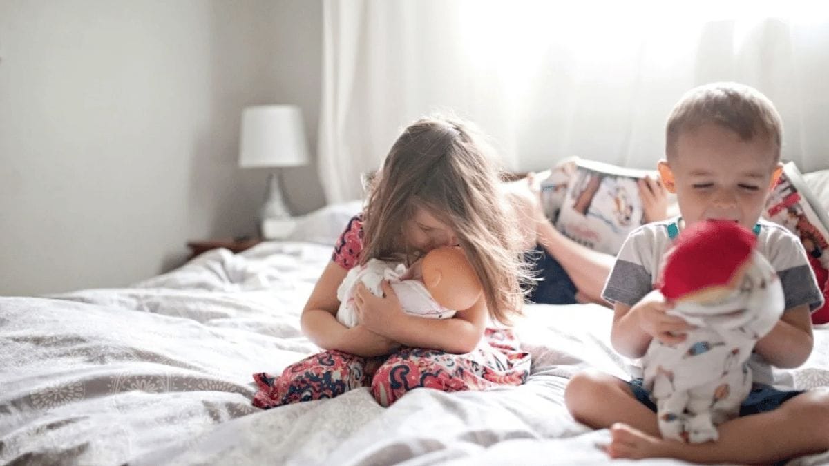 little girl hugging her doll - body safety