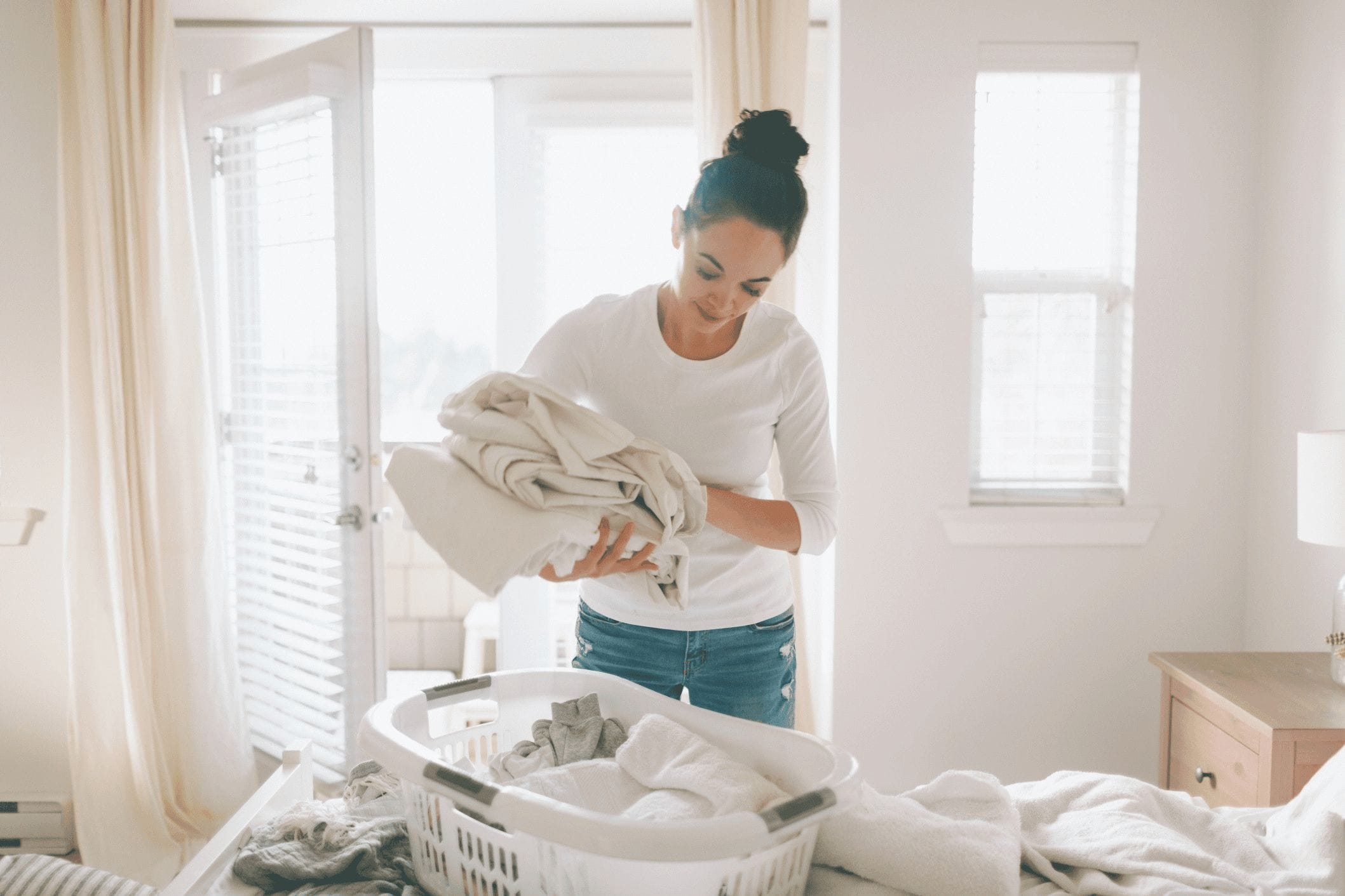 woman folding laundry