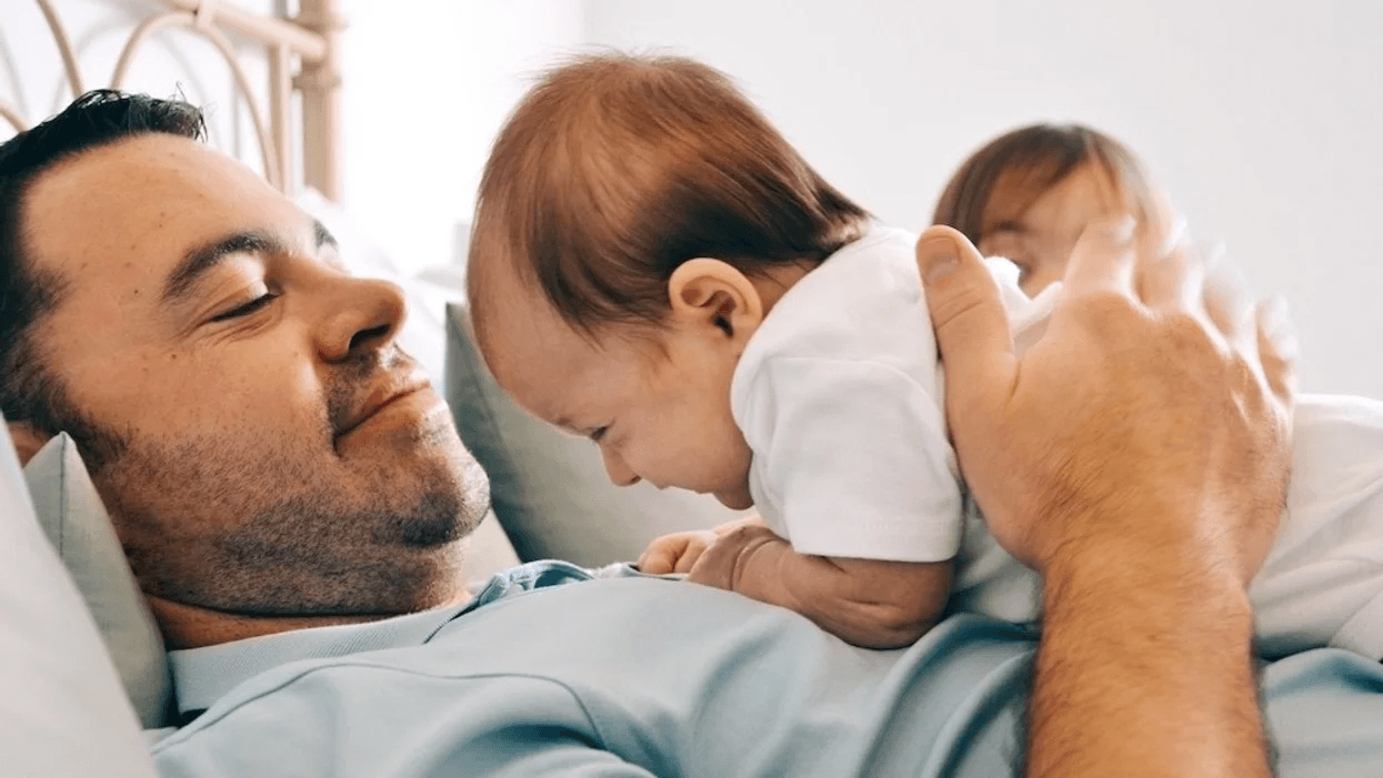 dad playing with baby