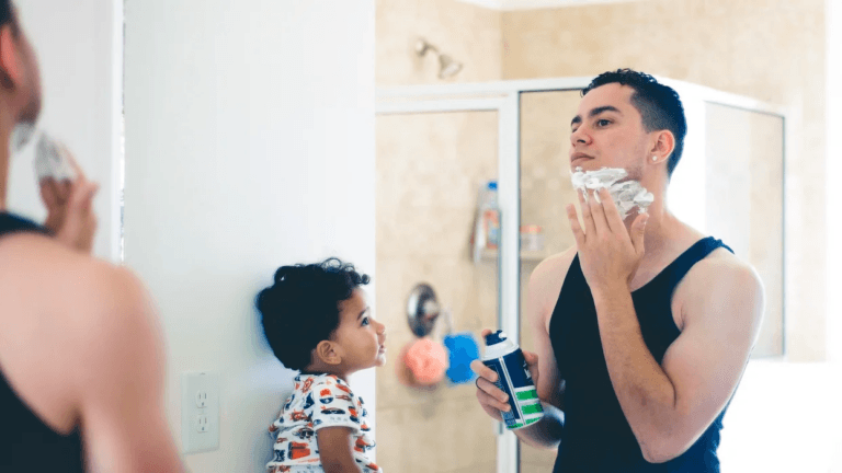 dad shaving with son watching