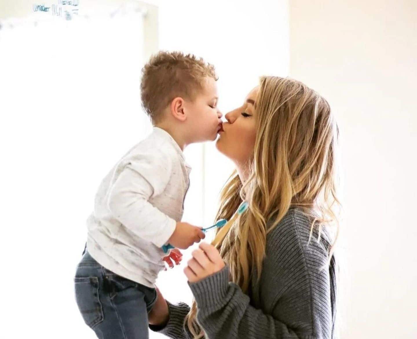 mom kissing son