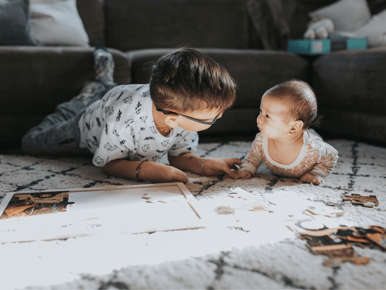 life with 2 kids: siblings playing on the floor together