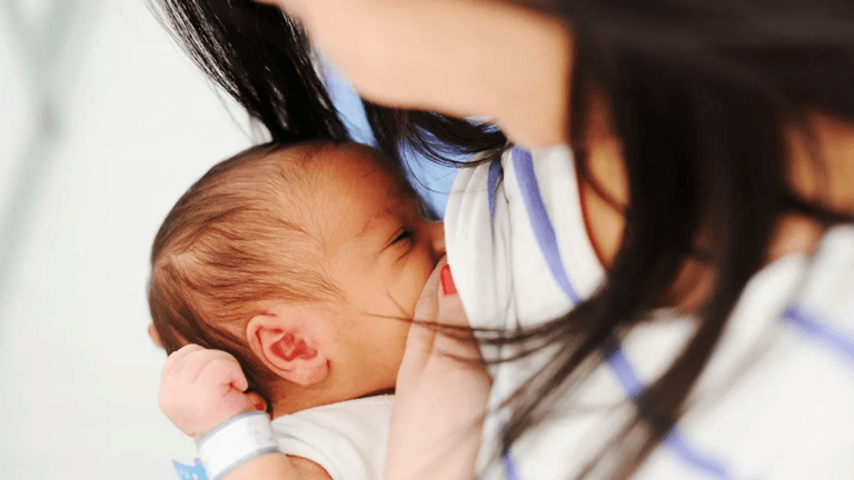 mom breastfeeding baby