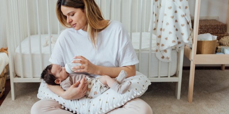 mom-in-nursery-bottle-feeding-baby