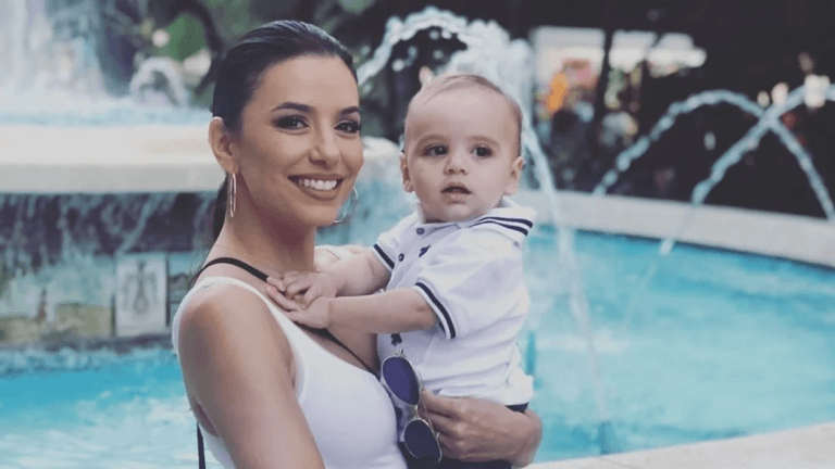 Eva Longoria holding her son