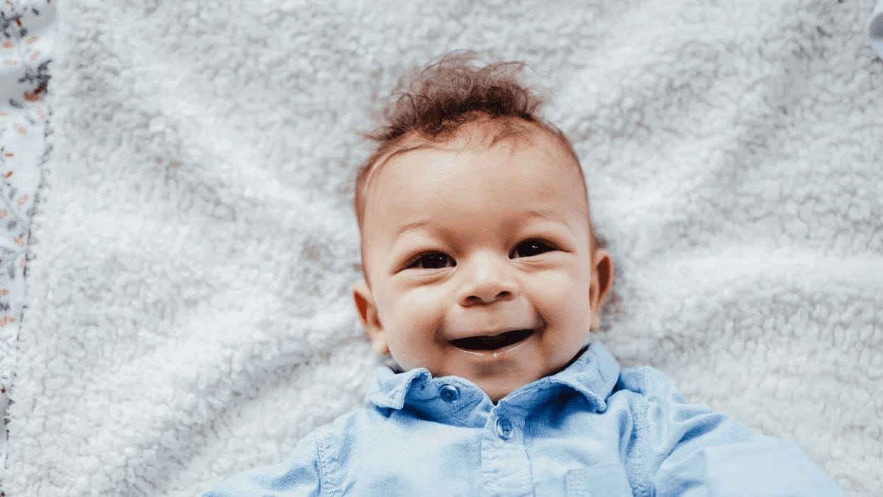 baby boy smiling at camera