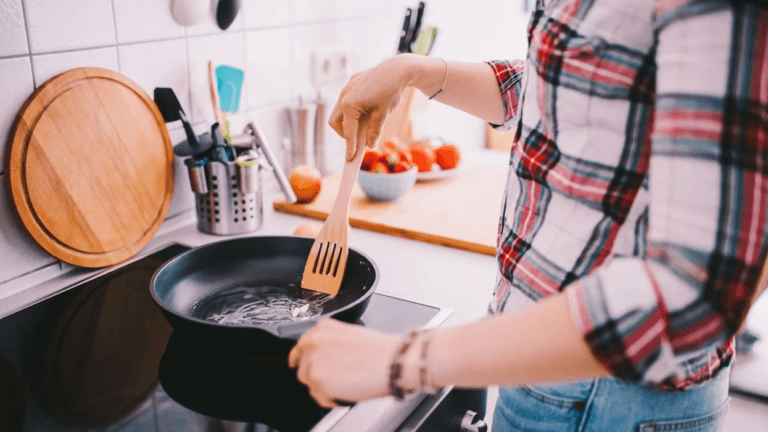 woman cooking on a stove