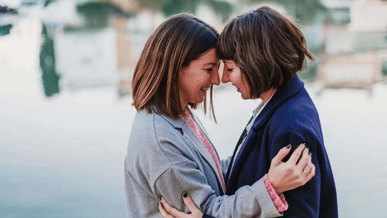 two women embracing -lgbtq family planning