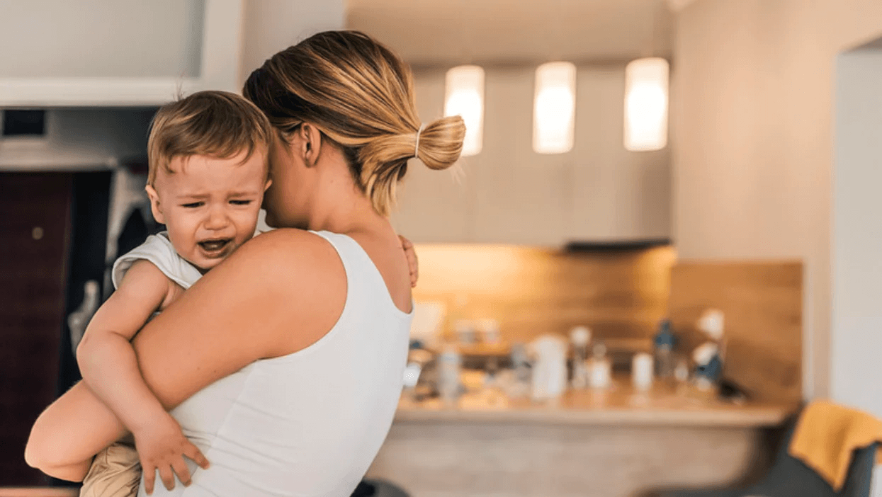 woman consoling a crying baby- toddler crying