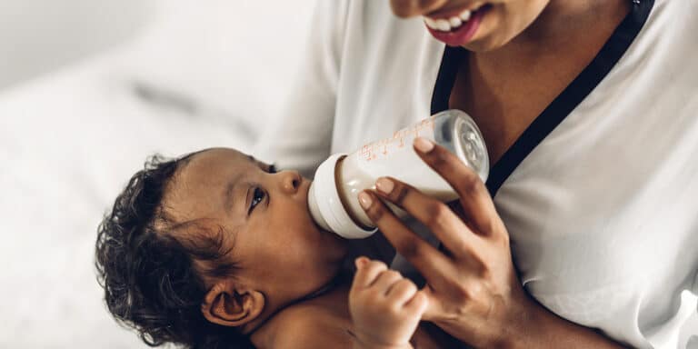 mother practicing combination feeding with infant