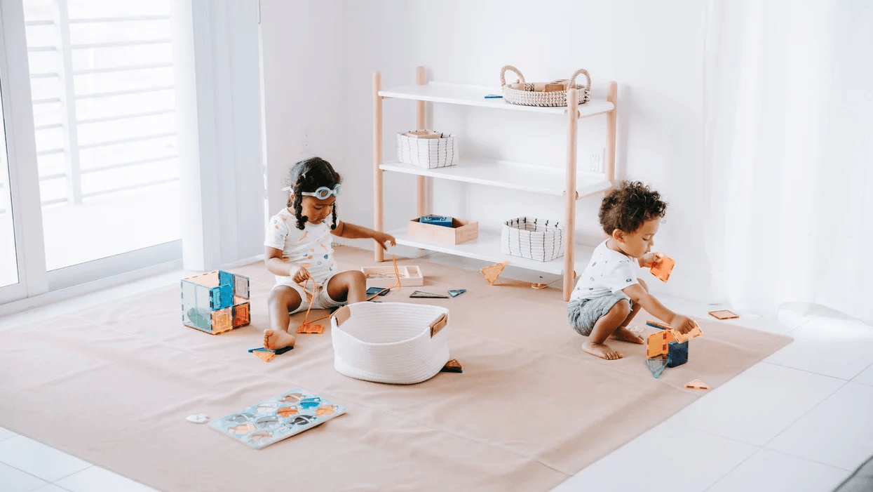 kids playing on a mat on the floor