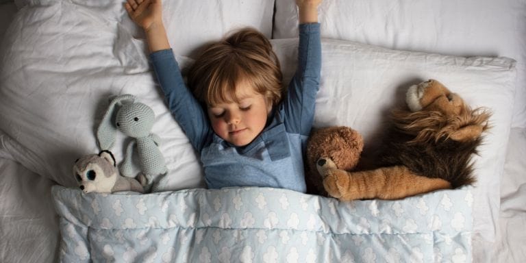 toddler sleeping with their arms up