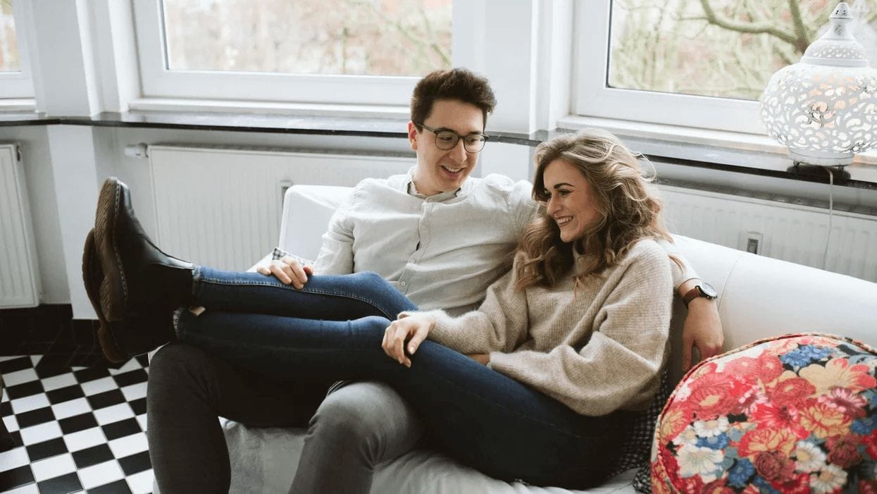 couple sitting on the couch snuggling