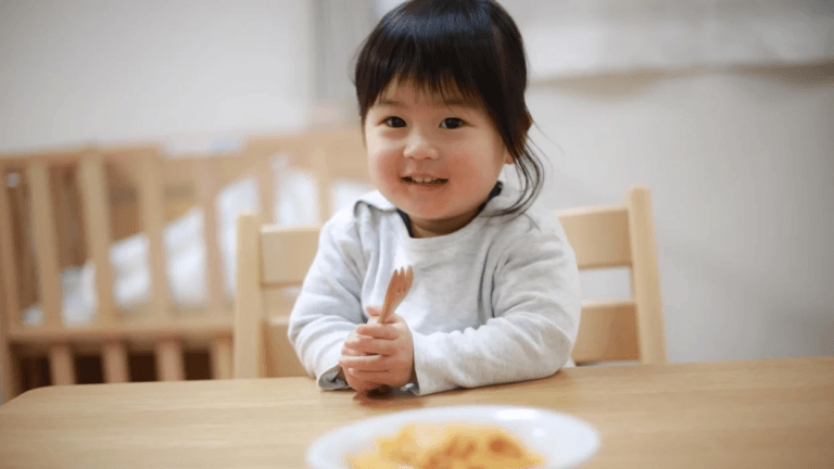 little girl eating food