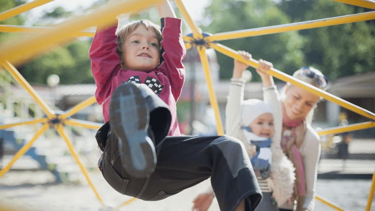 child playing on a montessori climbing toy