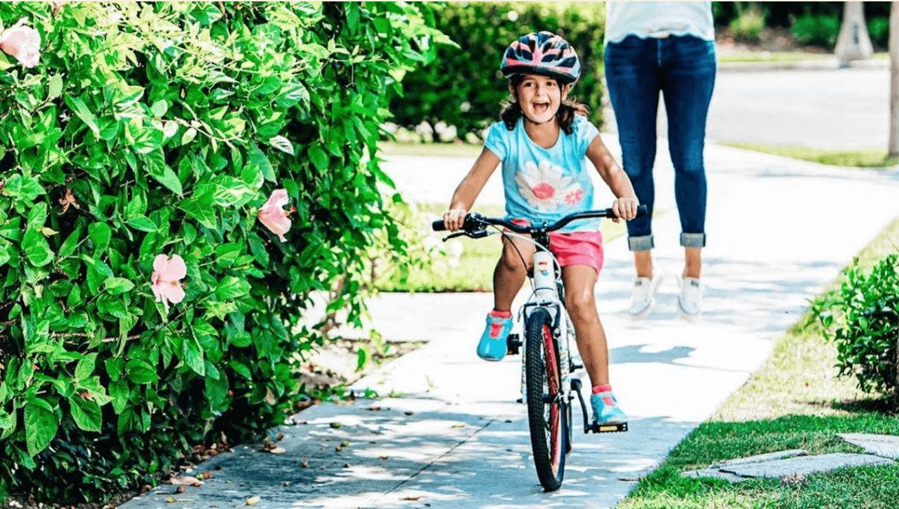 little girl riding a bike