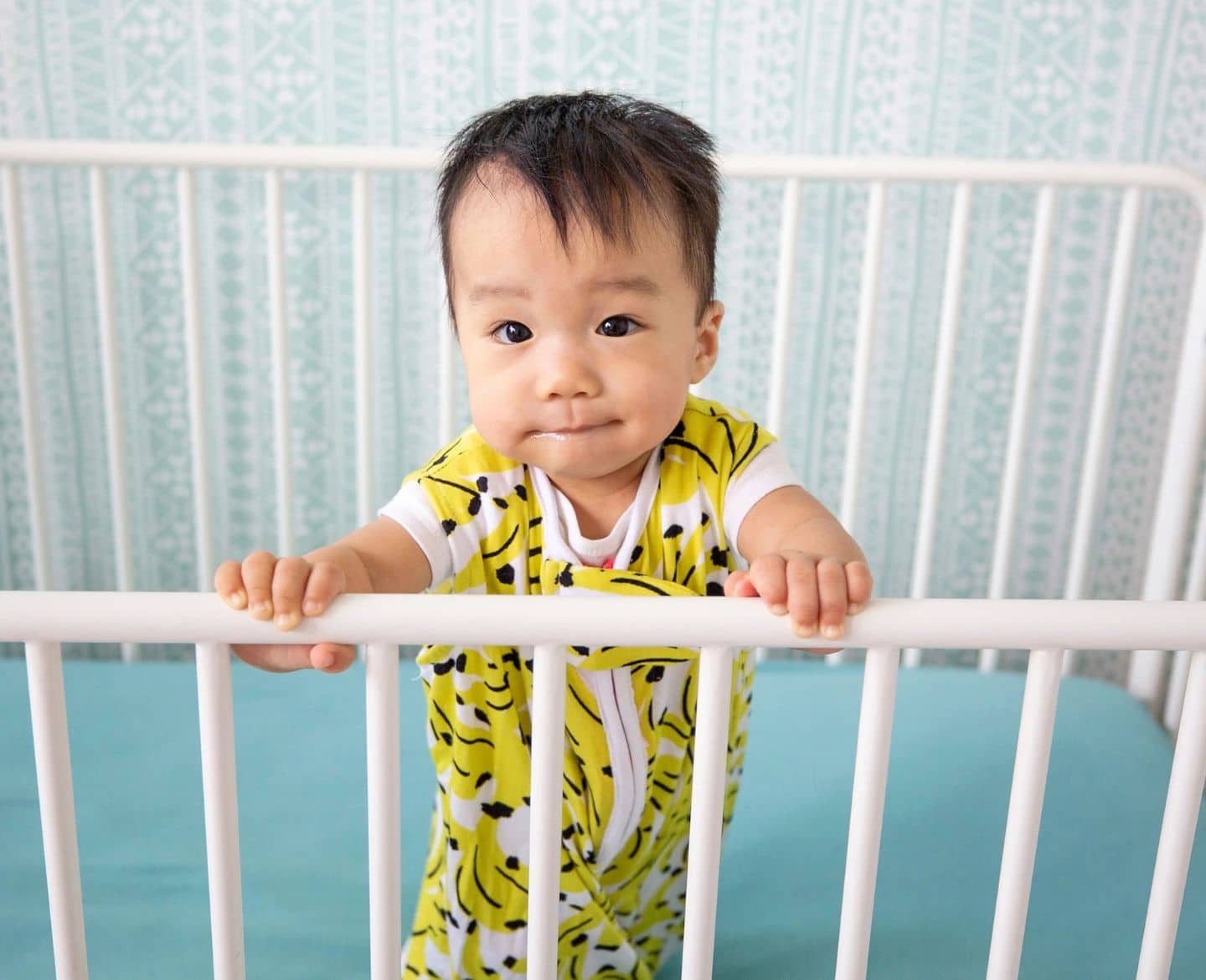 toddler-in-crib-wearing-toddler-sleep-sack