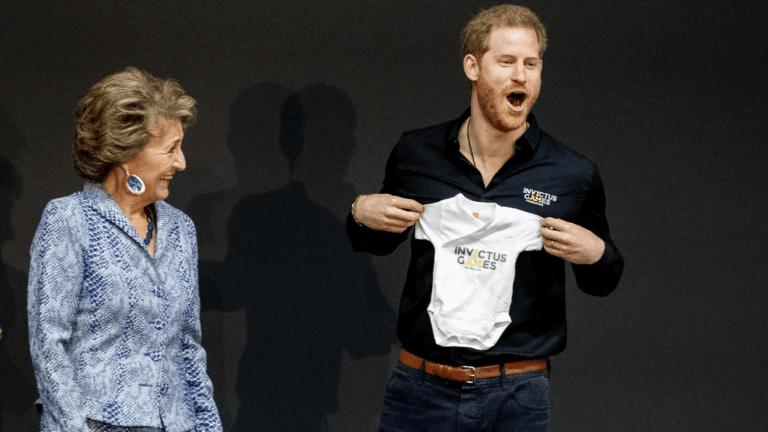 Prince Harry holding an Invictus Games onesie