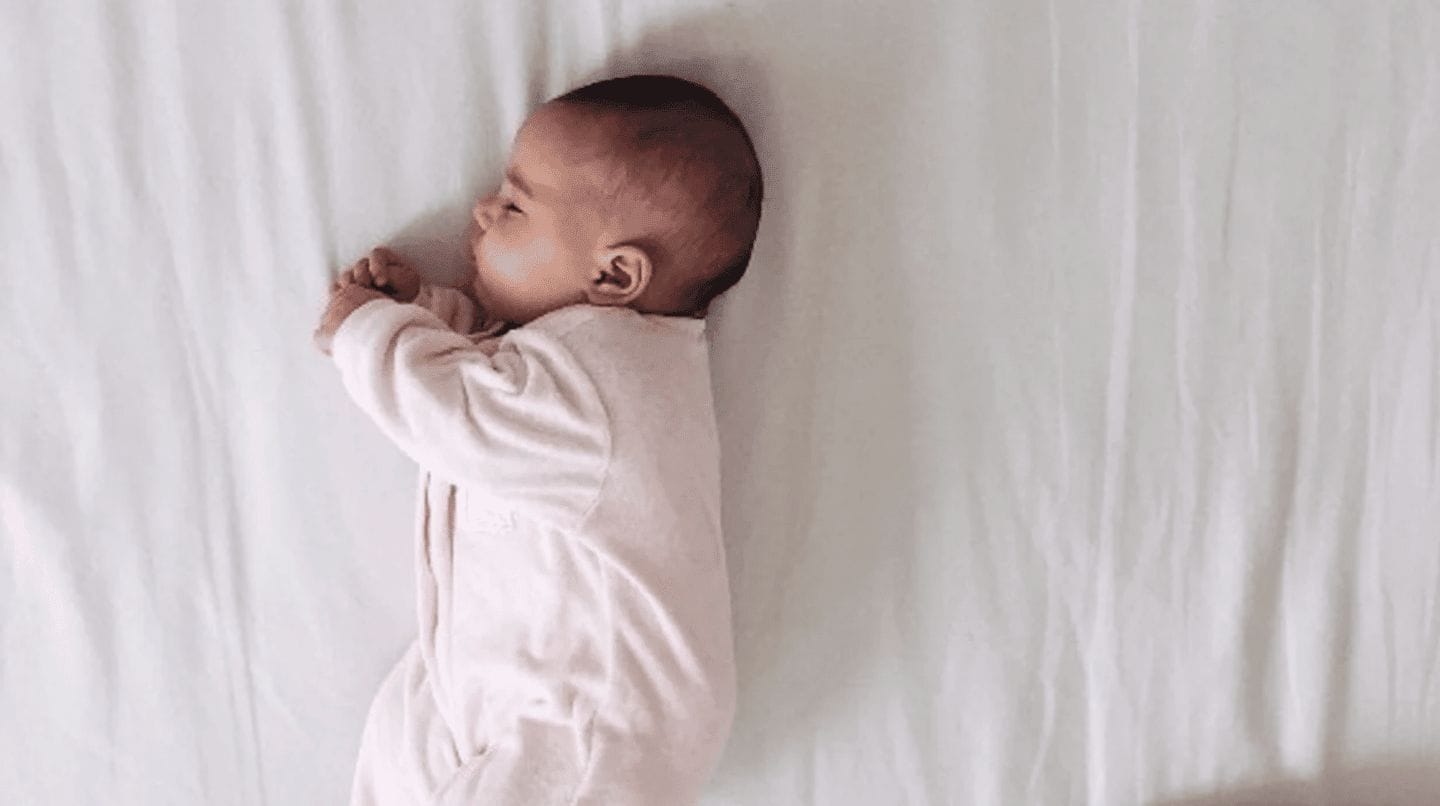 baby sleeping in a bed