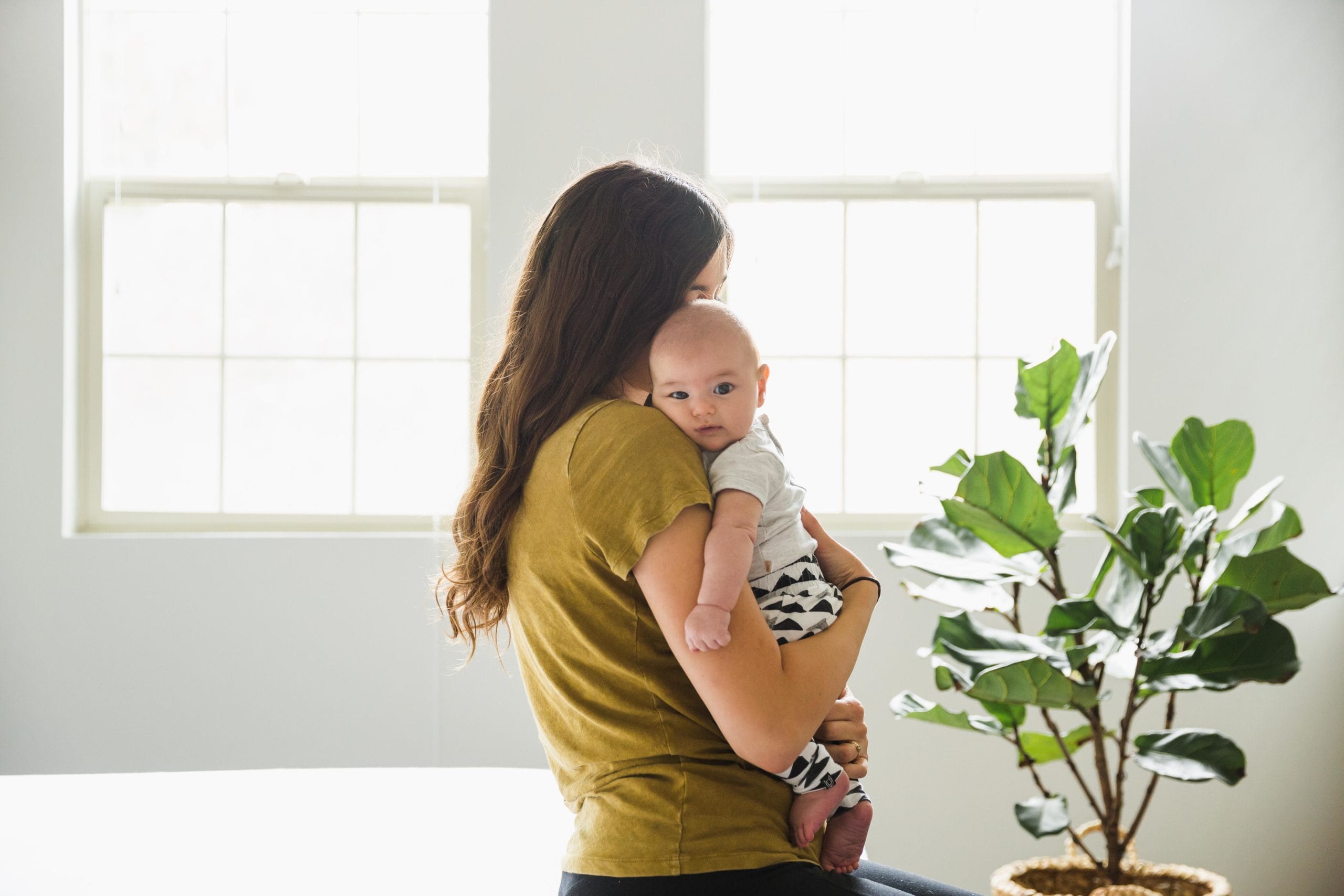 mother holding baby at home - postpartum depression drug