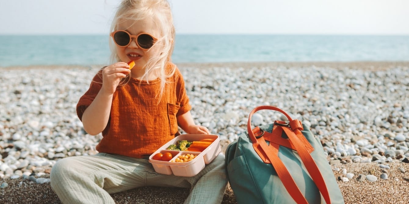 girl-sitting-outside-eating-lunch