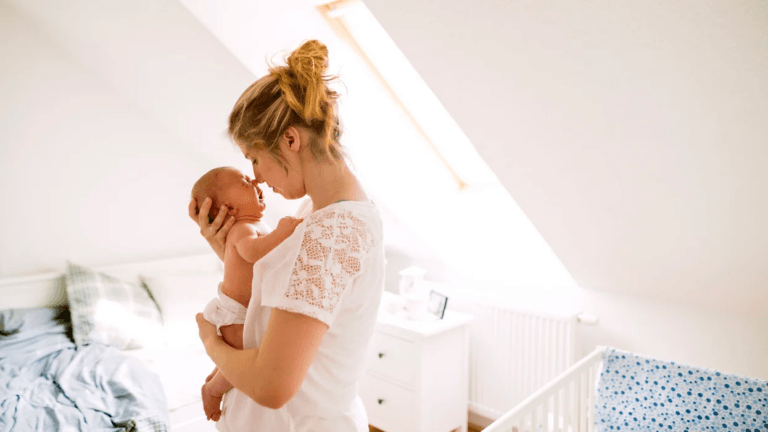 mom holding a crying baby