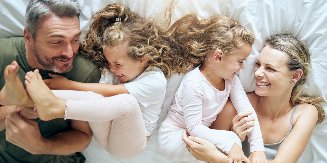 parents and kids playing on bed- i am grateful to be a mother