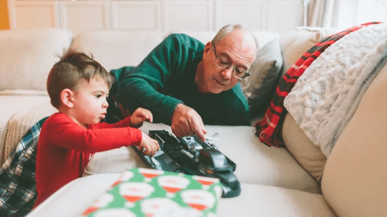 grandpa and boy christmas playing with toy- no more toys