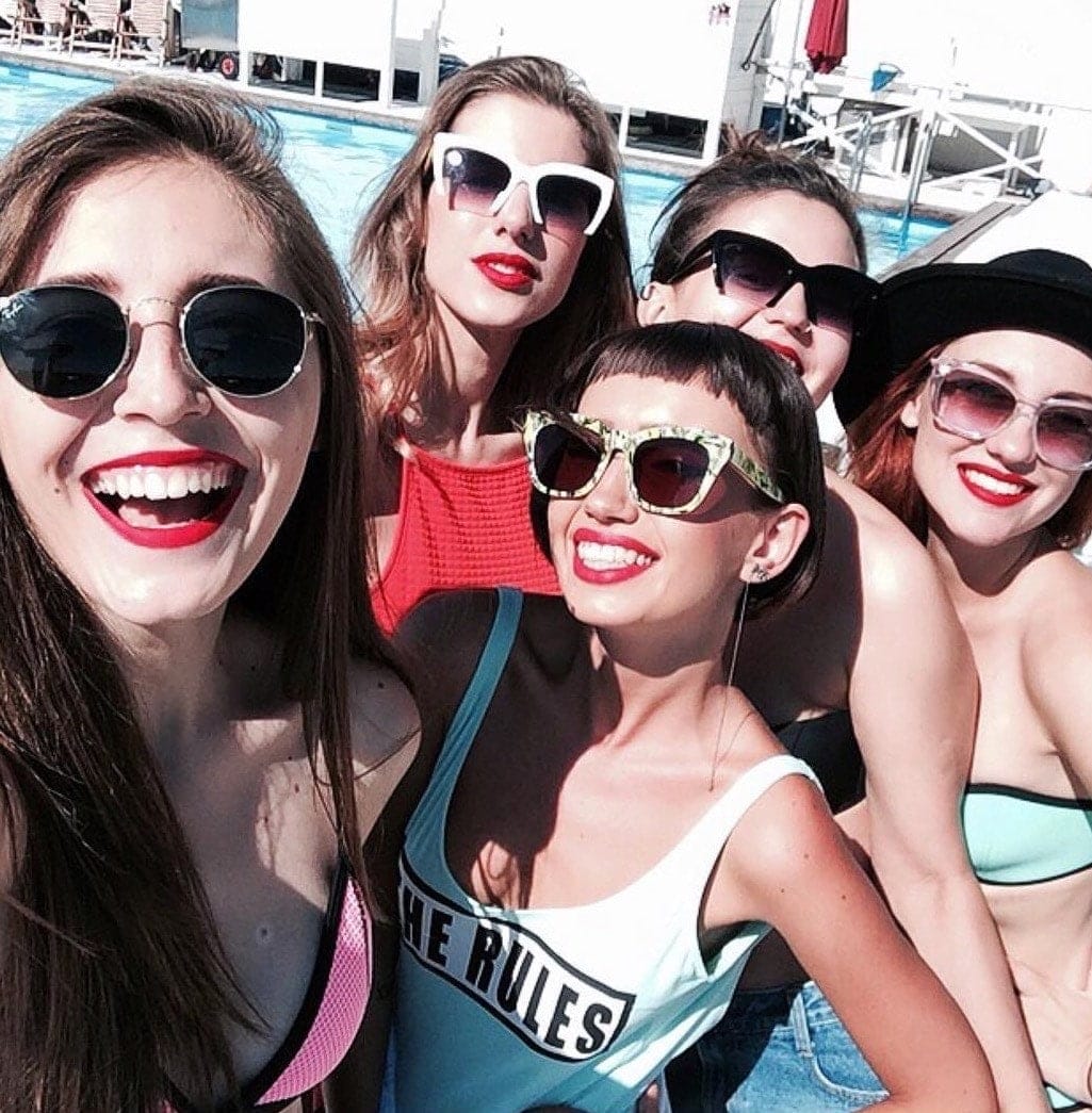 group of women taking a selfie outdoors