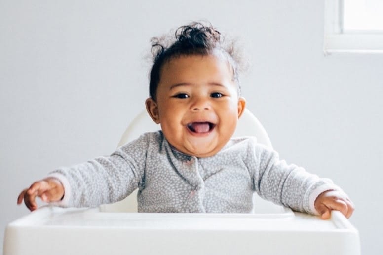 little boy in a high chair