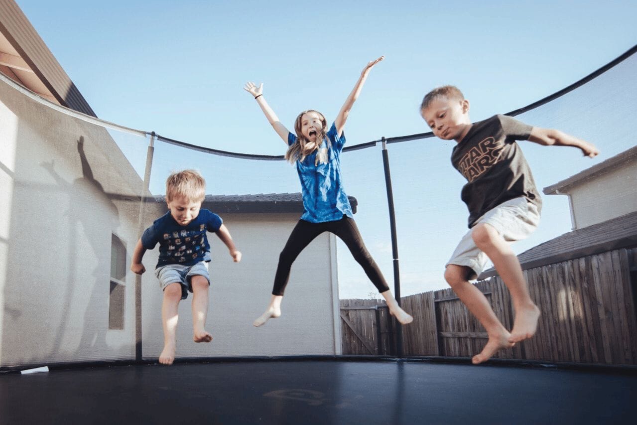 kids jumping on a trampoline