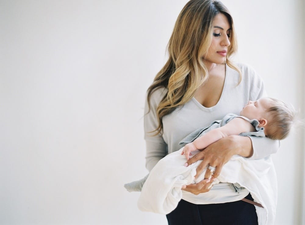 woman holding newborn baby