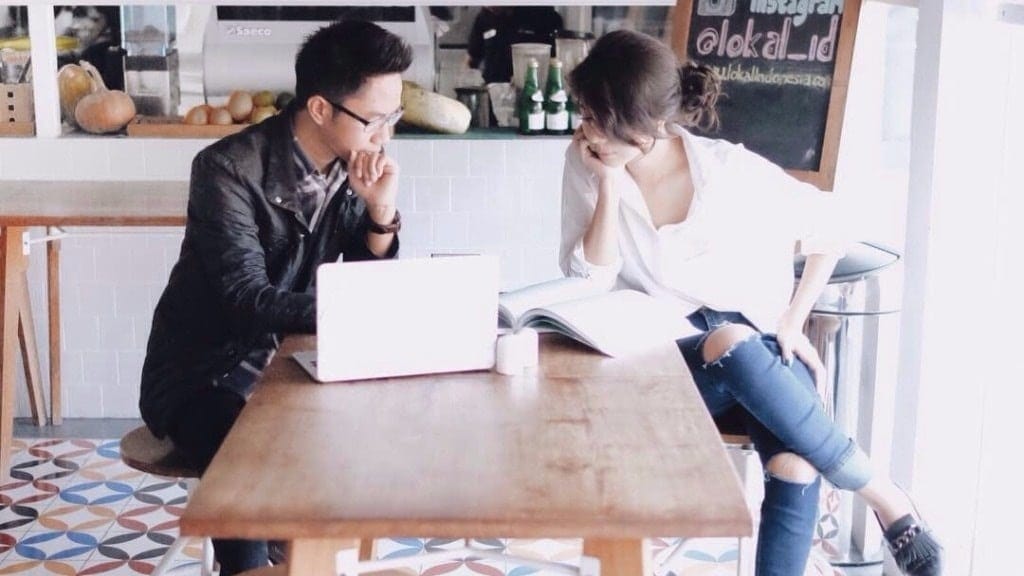 Man and woman sitting together