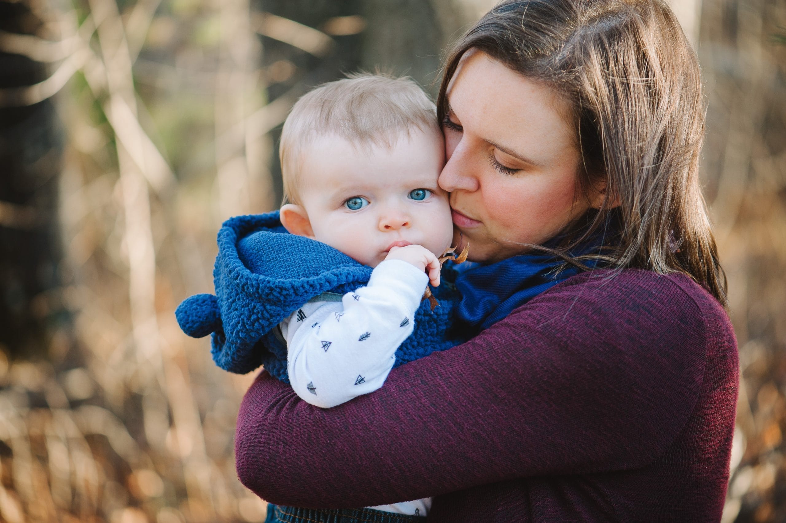 woman holding son outside