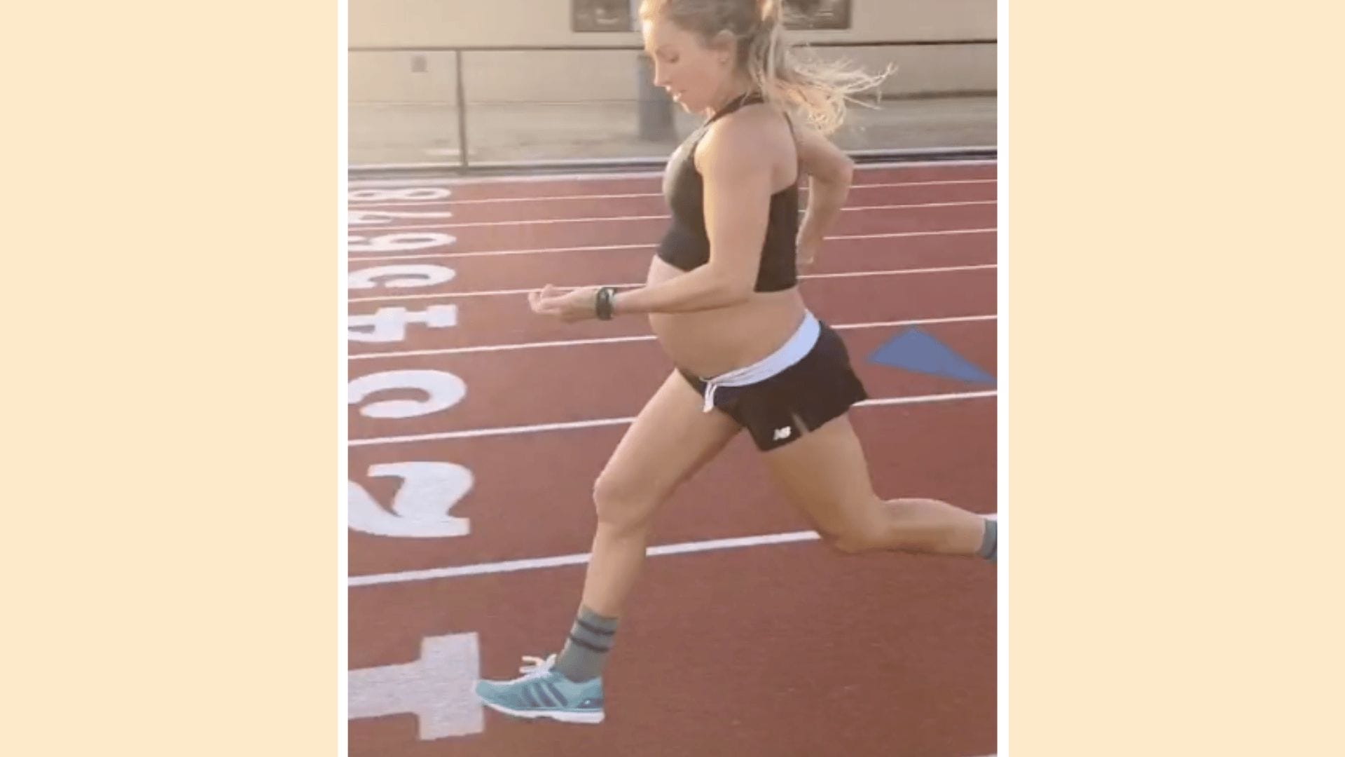 pregnant woman running on a track