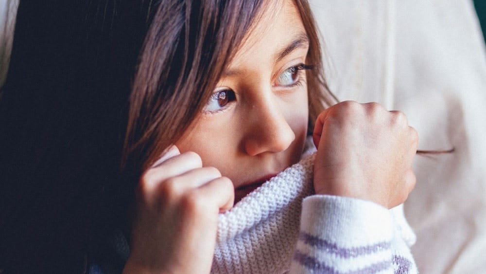 child playing with her turtleneck