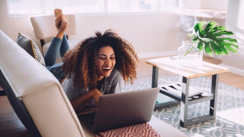 woman laughing at computer - wife mommy me