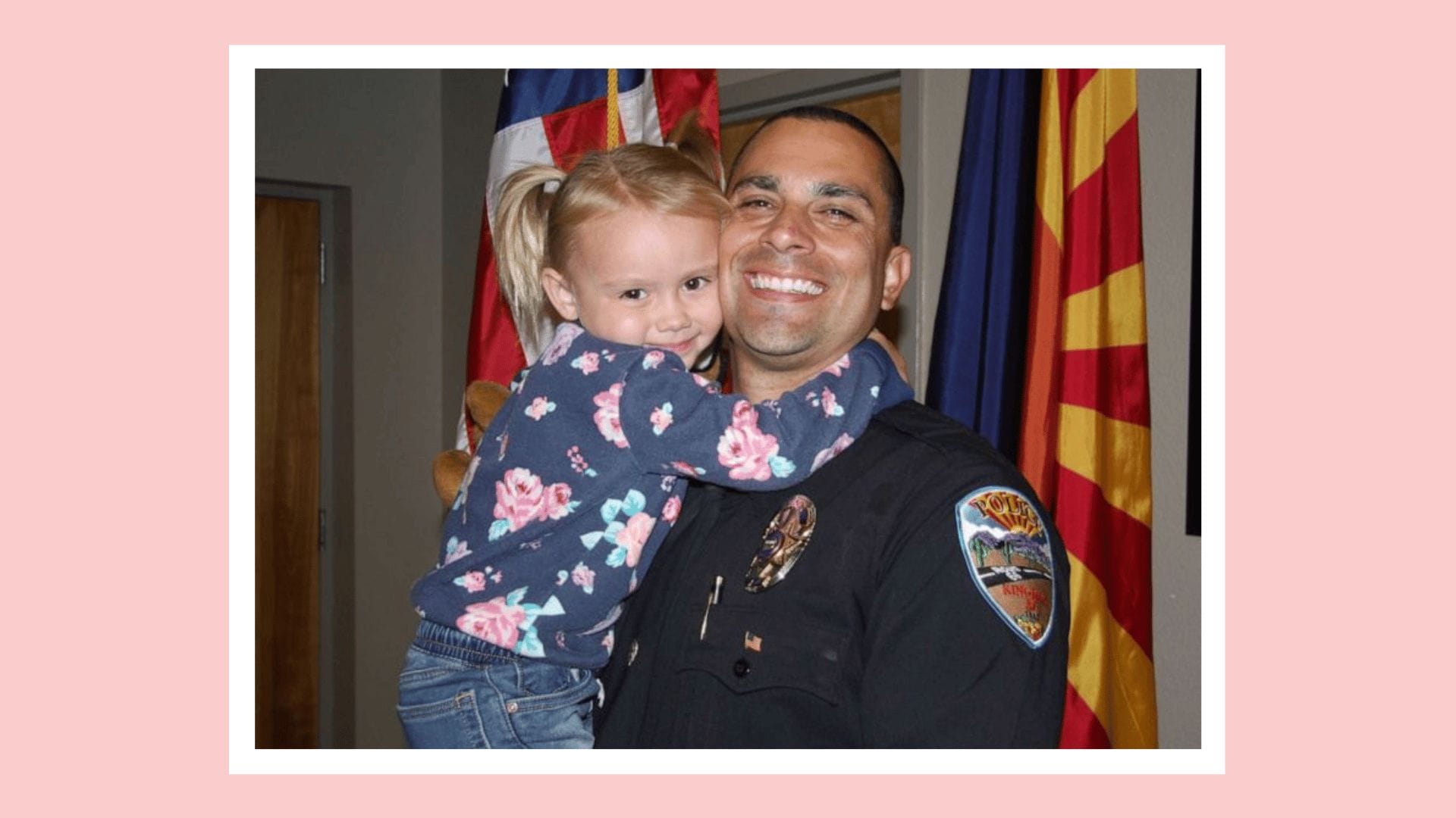 Lieutenant Brian Zach holding adopted daughter