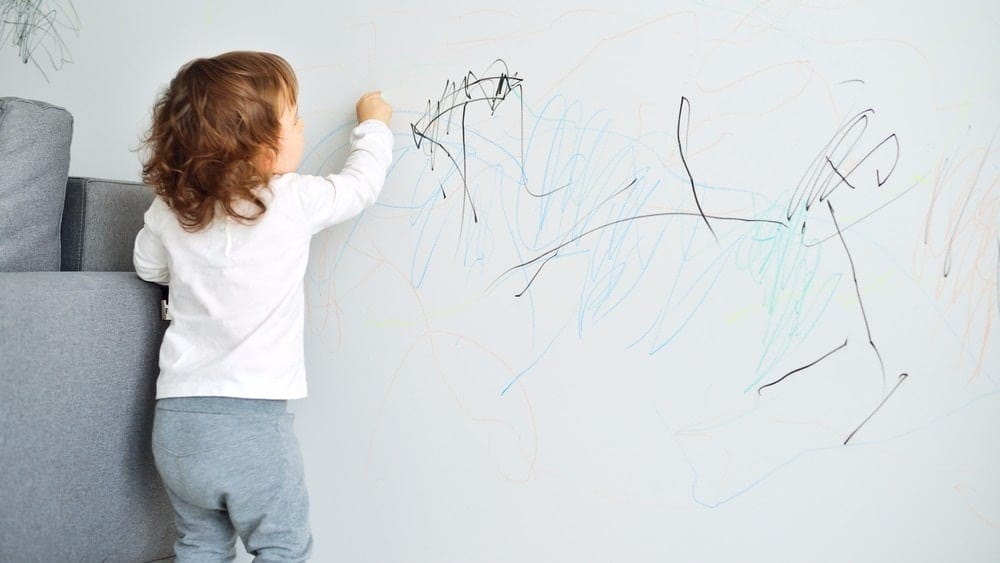 little girl drawing on the wall- natural consequences