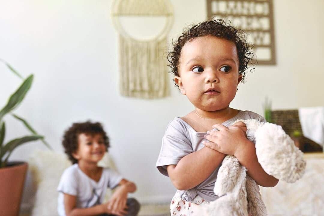 two siblings playing together