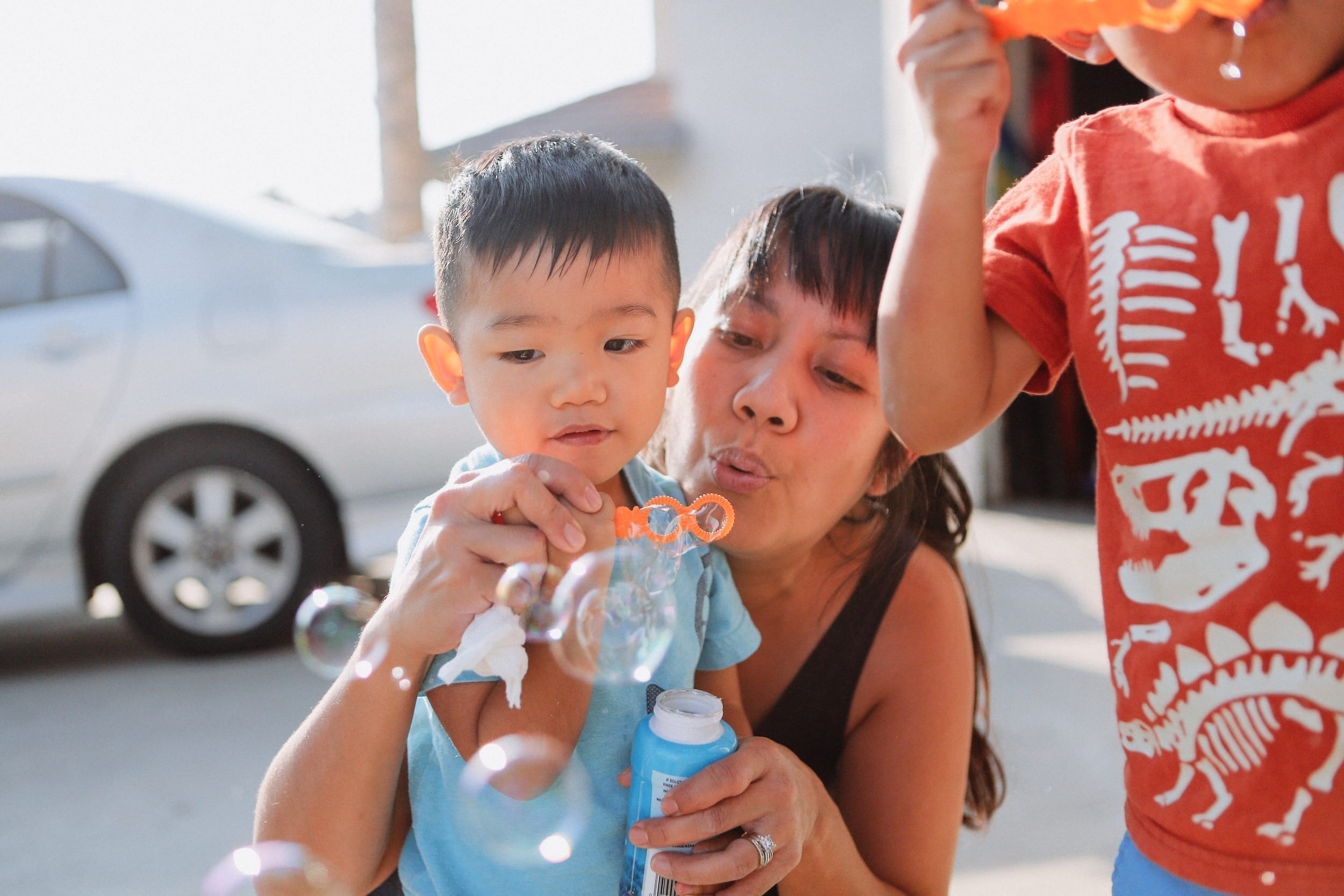 mom and son blowing bubbles