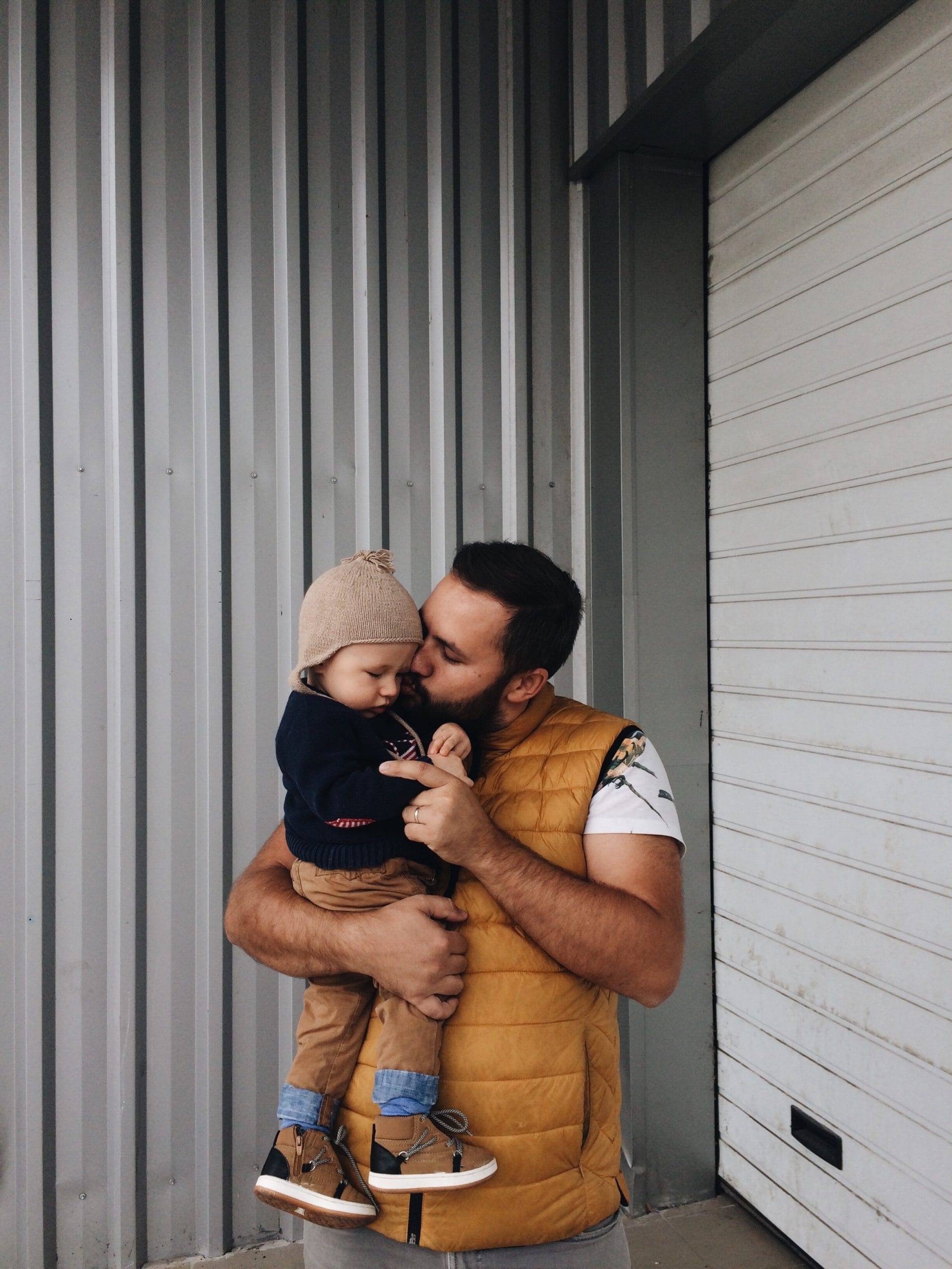 dad kissing baby